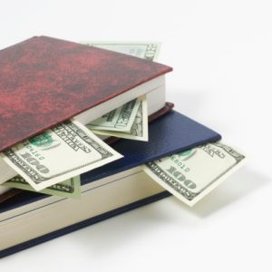 Stack of books and money