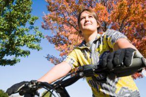 Low angle view of a woman riding a mountain bike